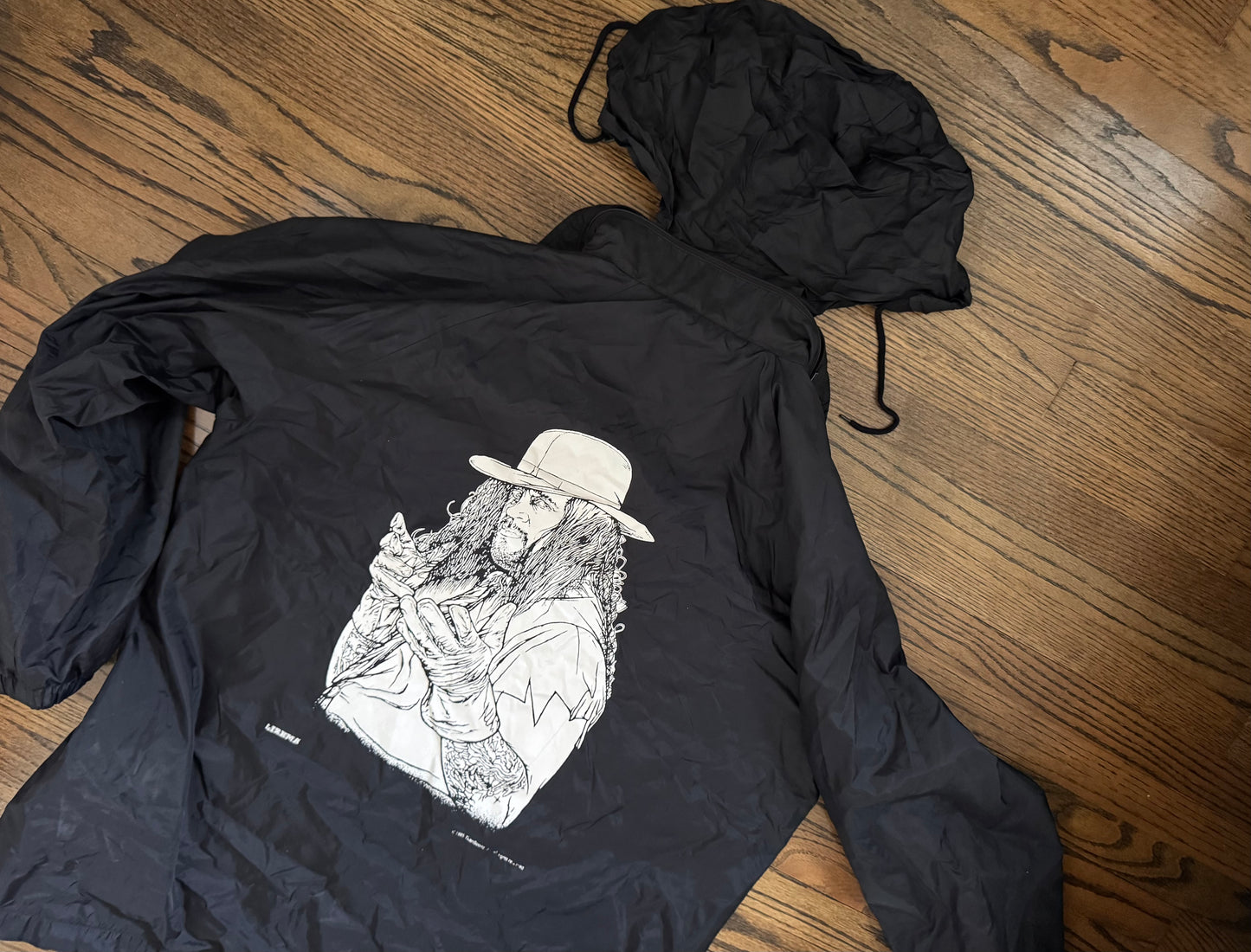 1995 WWF Undertaker windbreaker jacket with a zip up