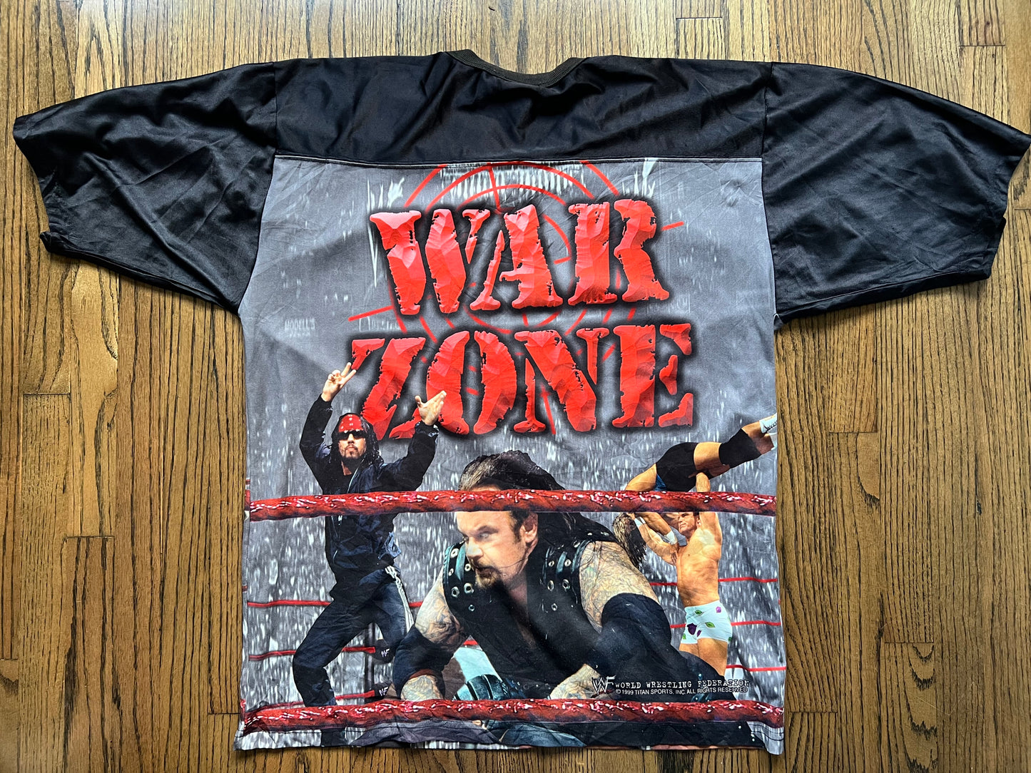 1999 WWF Raw / War Zone Jersey featuring The Rock, “Stone Cold” Steve Austin, Mankind, The Undertaker, X-Pac and “Badass” Billy Gunn