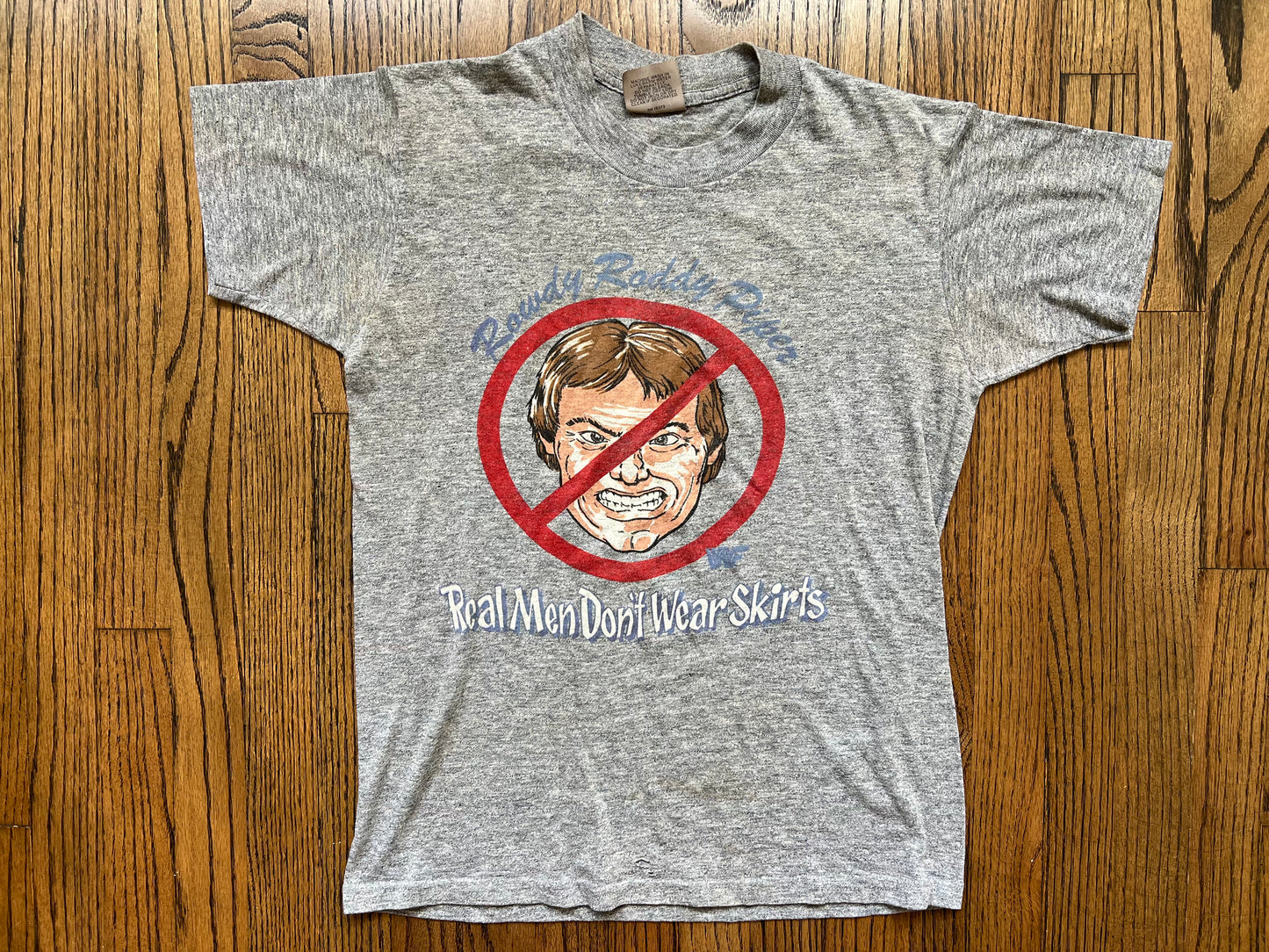 1985 WWF “Rowdy” Roddy Piper “Real Men Don’t Wear Skirts” shirt