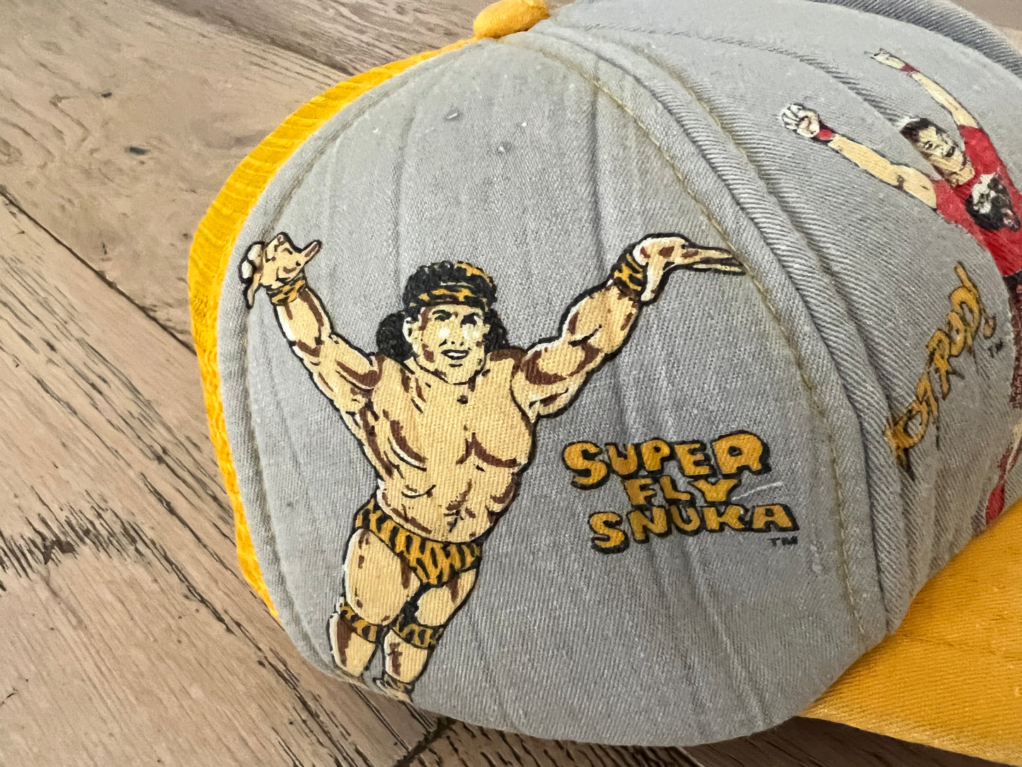 1985 WWF Kid’s Hat featuring World Wrestling Federation Heavyweight Champion Hulk Hogan, “Superfly” Jimmy Snuka, Andre the Giant and “Rowdy” Roddy Piper