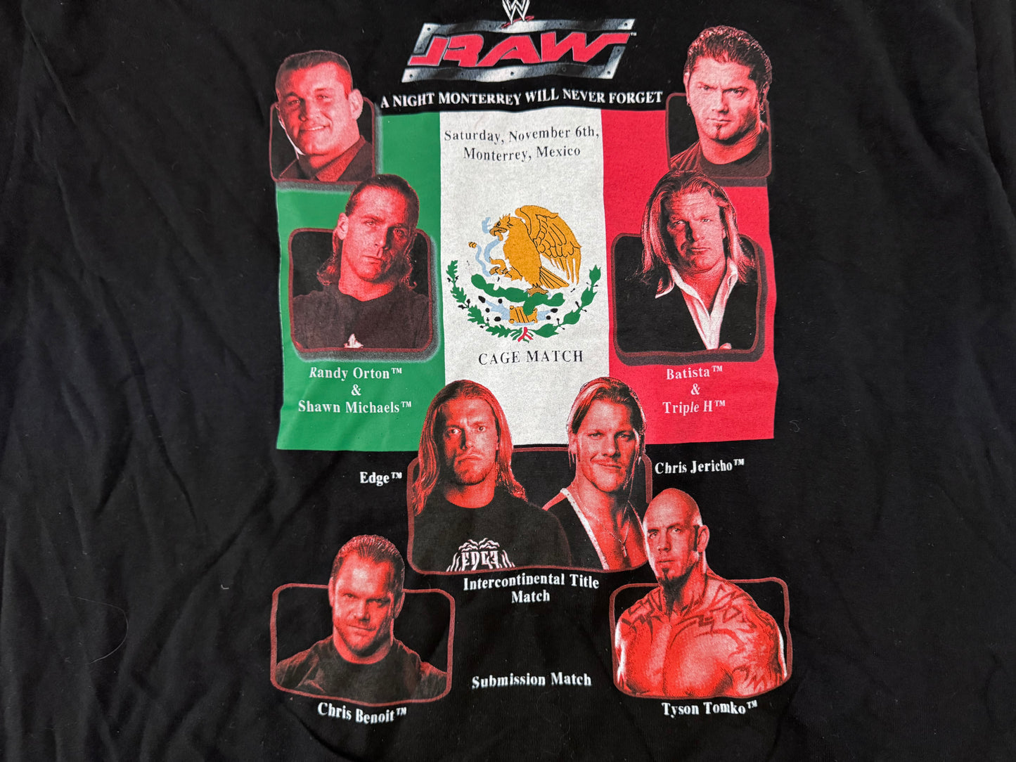 2004 WWE “A Night Monterrey Will Never Forget” shirt featuring Batista, Randy Orton, Shawn Michaels , HHH, Edge, Chris Jericho, Chris Benoit and Tyson Tomko two sided shirt