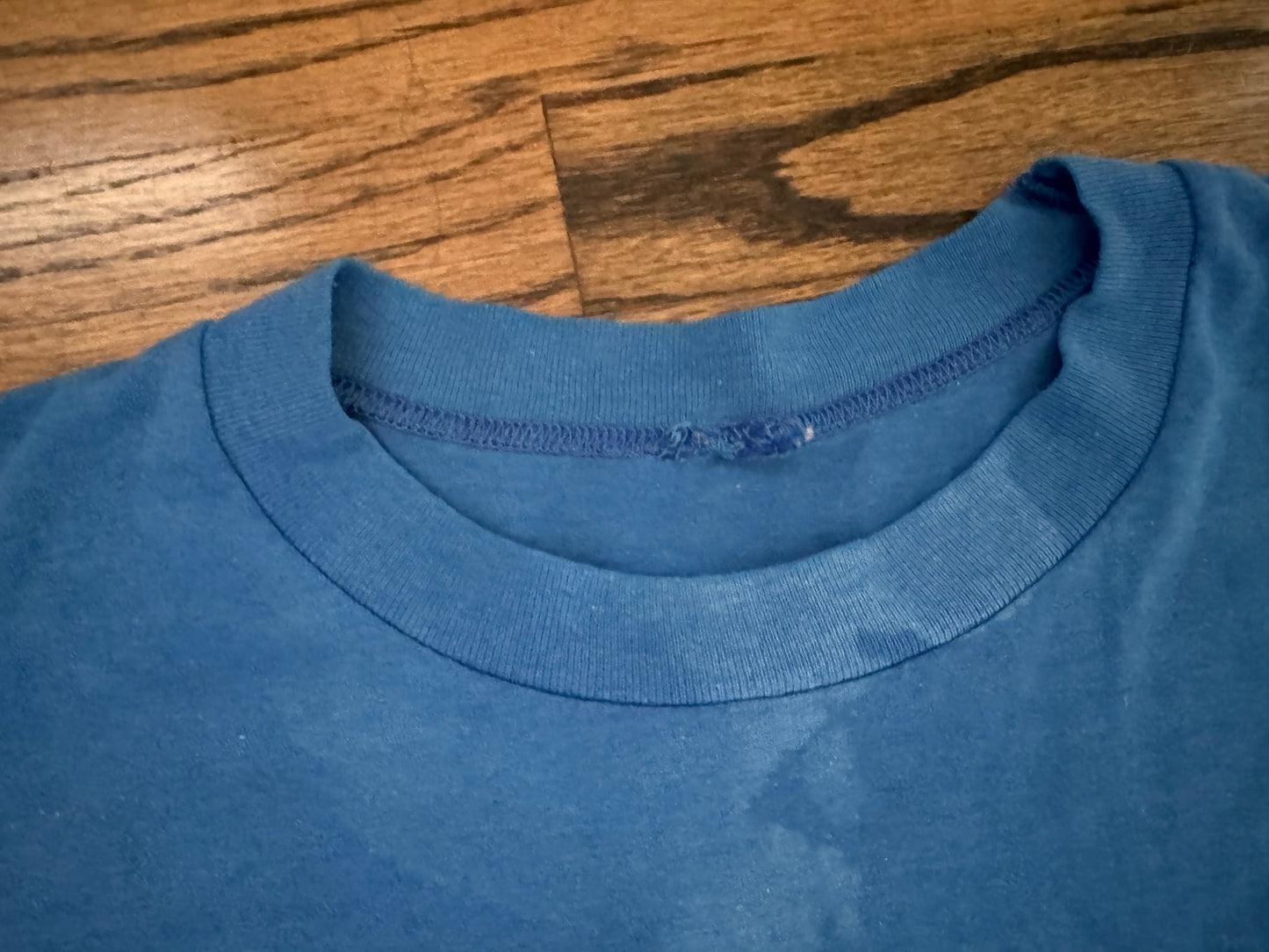 1987 NWA JCP STARRCADE shirt featuring The Road Warriors, “Rugged” Ronnie Garvin, “The Nature Boy” Ric Flair, “The American Dream” Dusty Rhodes and “the Total Package” lex luger