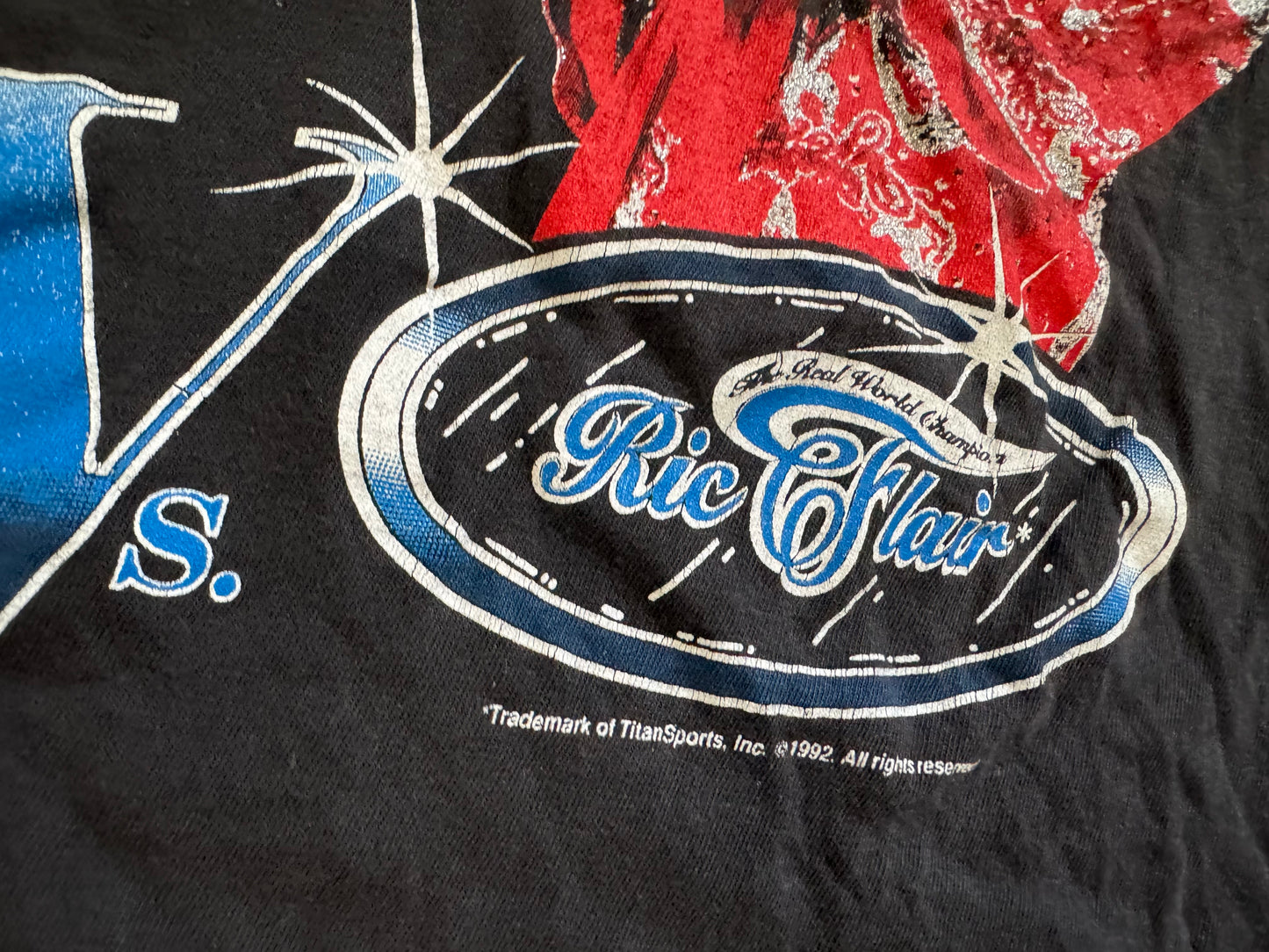 1992 WWF Superstars shirt featuring Intercontinental Champion Bret “The Hitman” Hart and The Real World’s Champion “The Nature Boy” Ric Flair