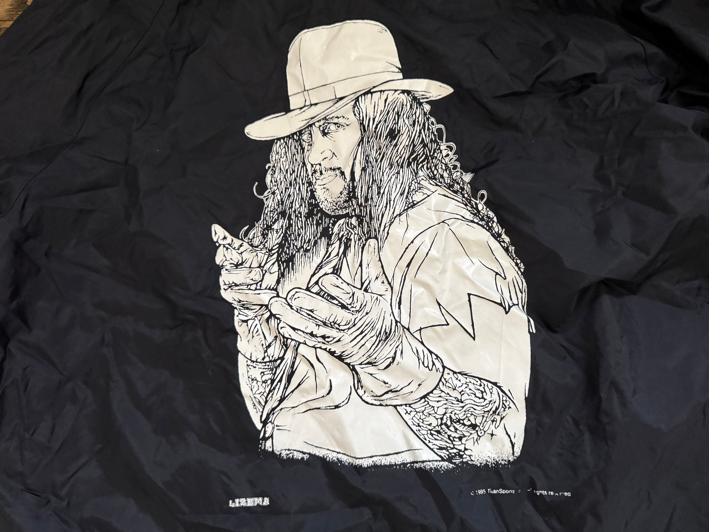1995 WWF Undertaker windbreaker jacket with a zip up