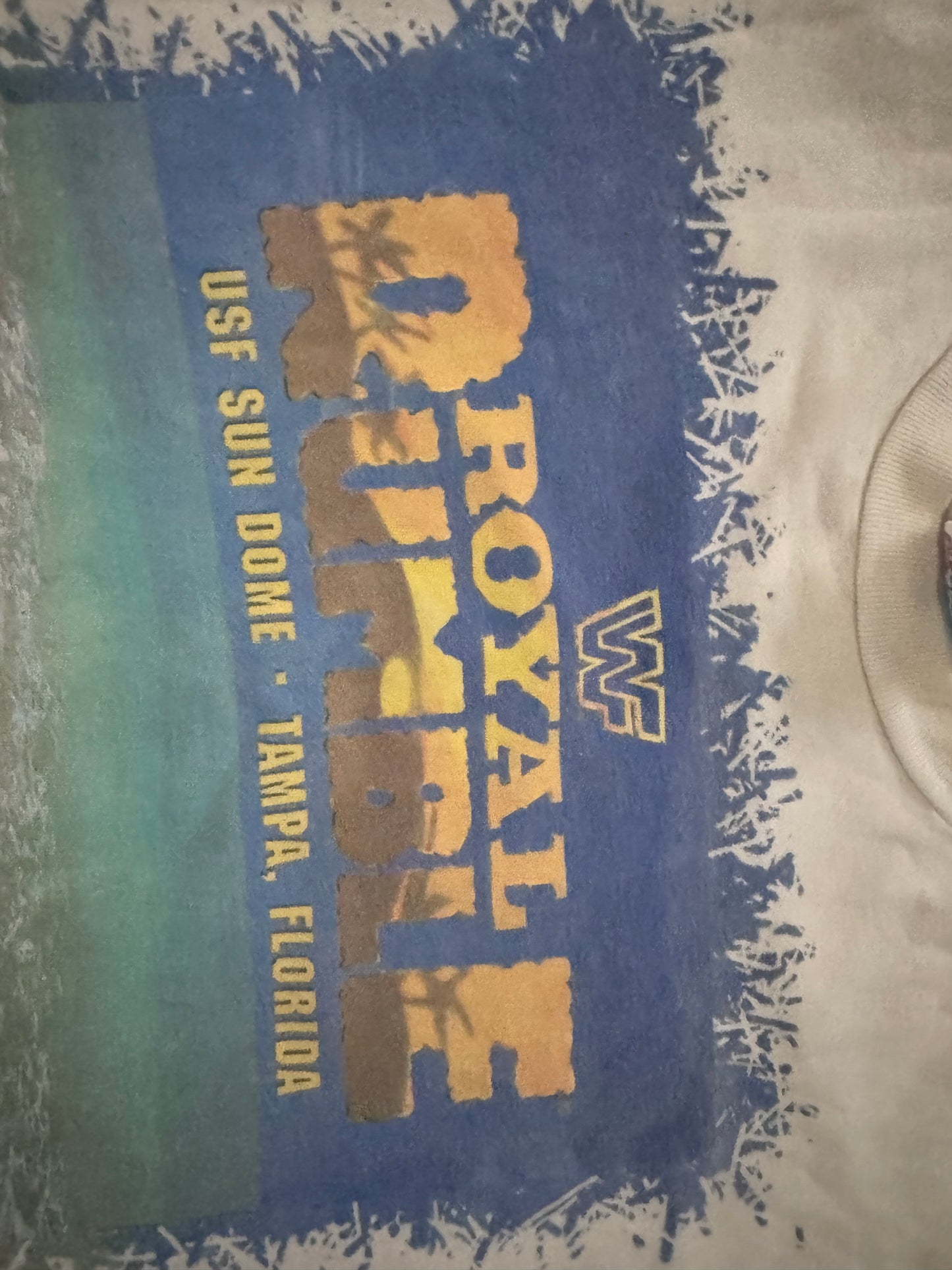 1995 WWF Royal Rumble shirt featuring a Flamingo, Bam Bam Bigelow, Crush’s 3rd gimmick in 3 years, Tatanka, Fatu, Sir Mo, Maybe the Smoking Gunns? Palm Trees, Lex Luger and Adam Bomb