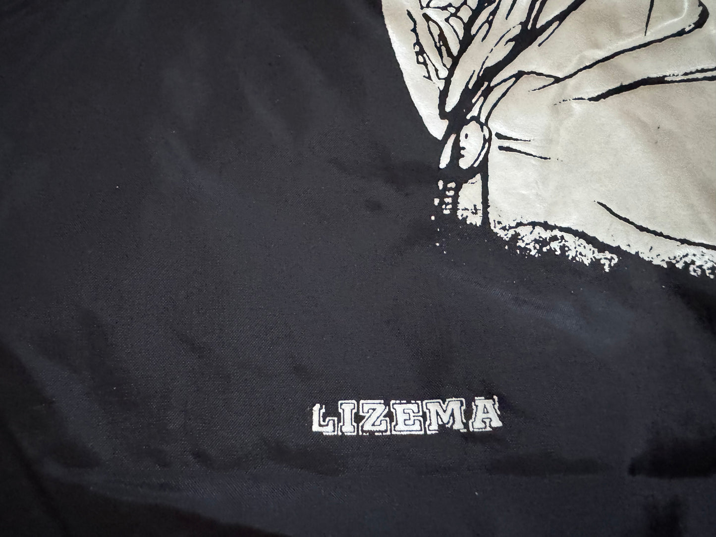 1995 WWF Undertaker windbreaker jacket with a zip up