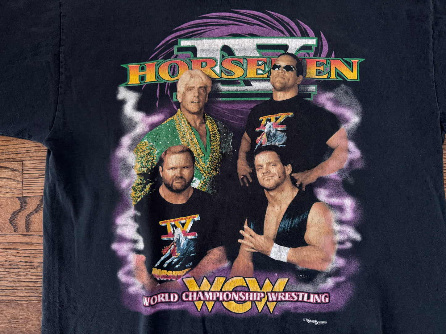 1996 WCW Four Horsemen shirt featuring “The Nature Boy” Ric Flair, Steve “Mongo” McMichael, “The Enforcer” Arn Anderson and “The Crippler” Chris Benoit

 