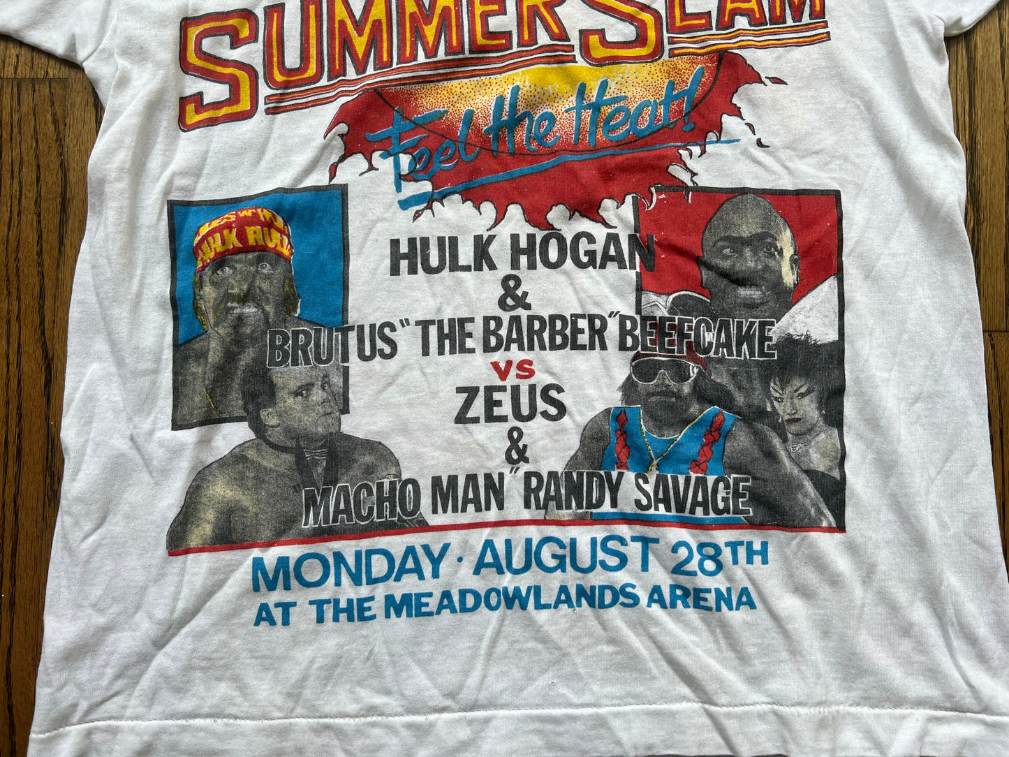 1989 WWF SummerSlam “Feel the Heat!” Parking lot bootleg event shirt featuring “Macho Man” Randy Savage, “The Human Wrecking Machine” Zeus, The “Sensational Queen” Sherri, Hulk Hogan and Brutus “The Barber” Beefcake