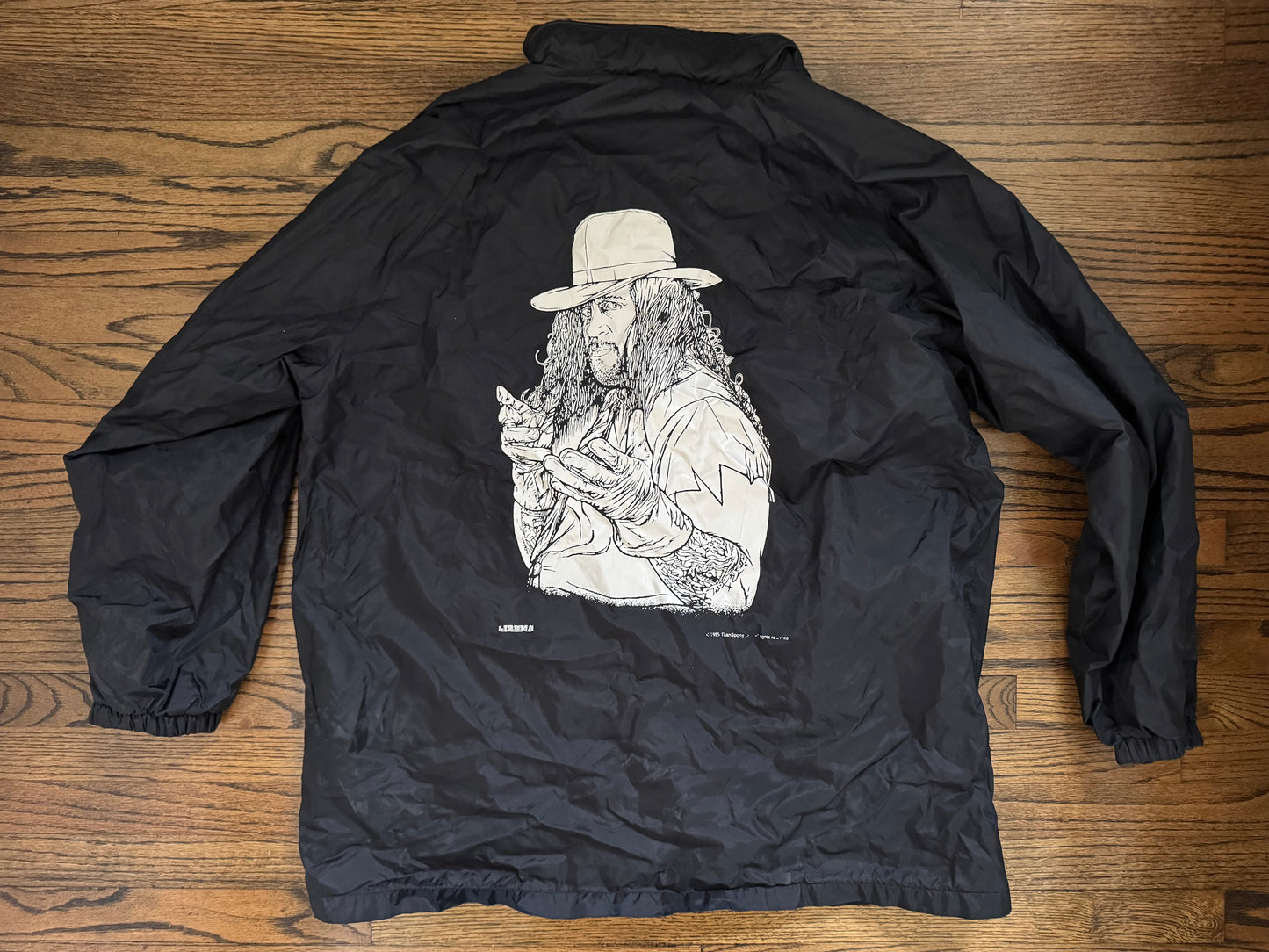 1995 WWF Undertaker windbreaker jacket with a zip up