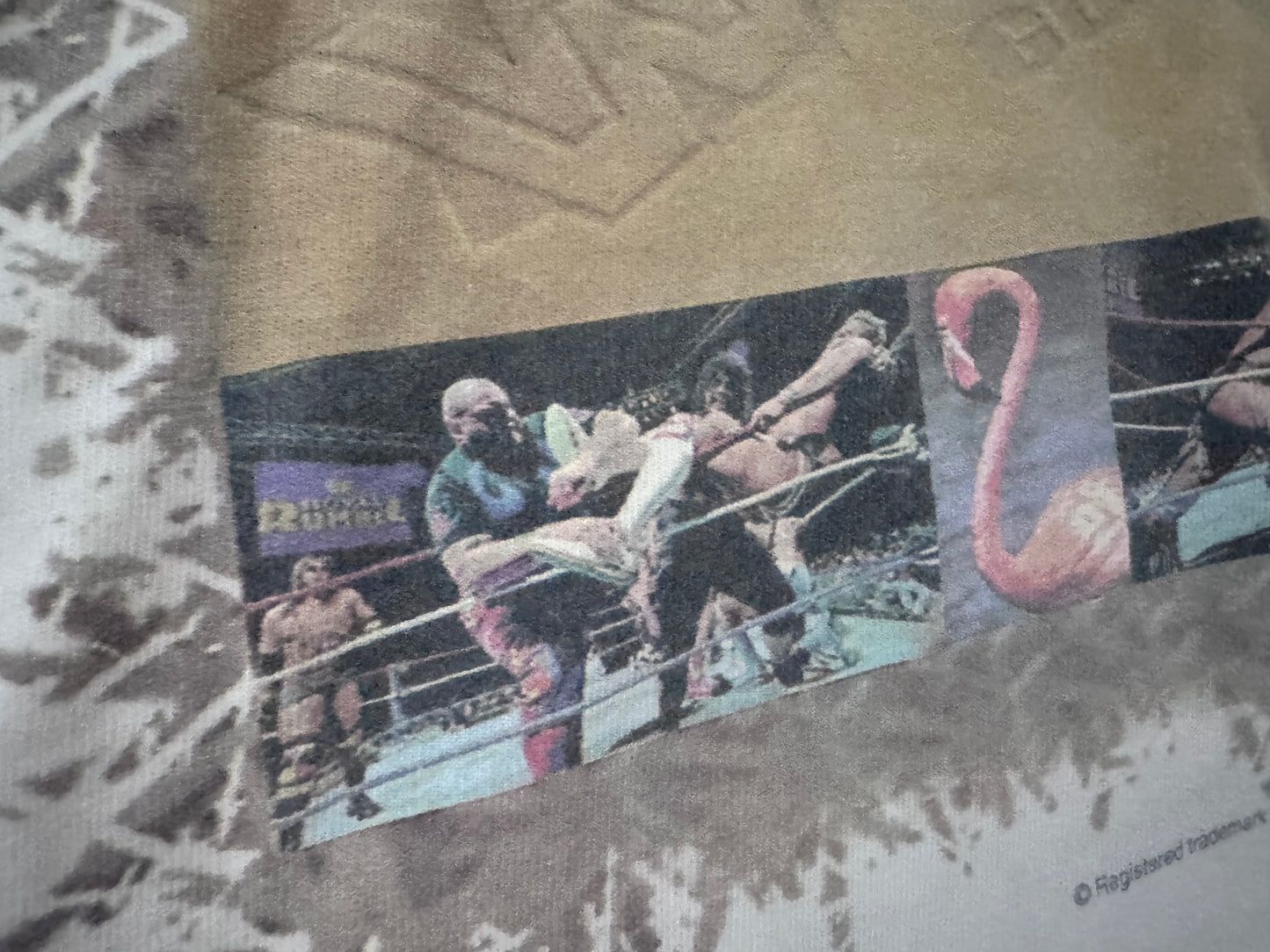 1995 WWF Royal Rumble shirt featuring a Flamingo, Bam Bam Bigelow, Crush’s 3rd gimmick in 3 years, Tatanka, Fatu, Sir Mo, Maybe the Smoking Gunns? Palm Trees, Lex Luger and Adam Bomb