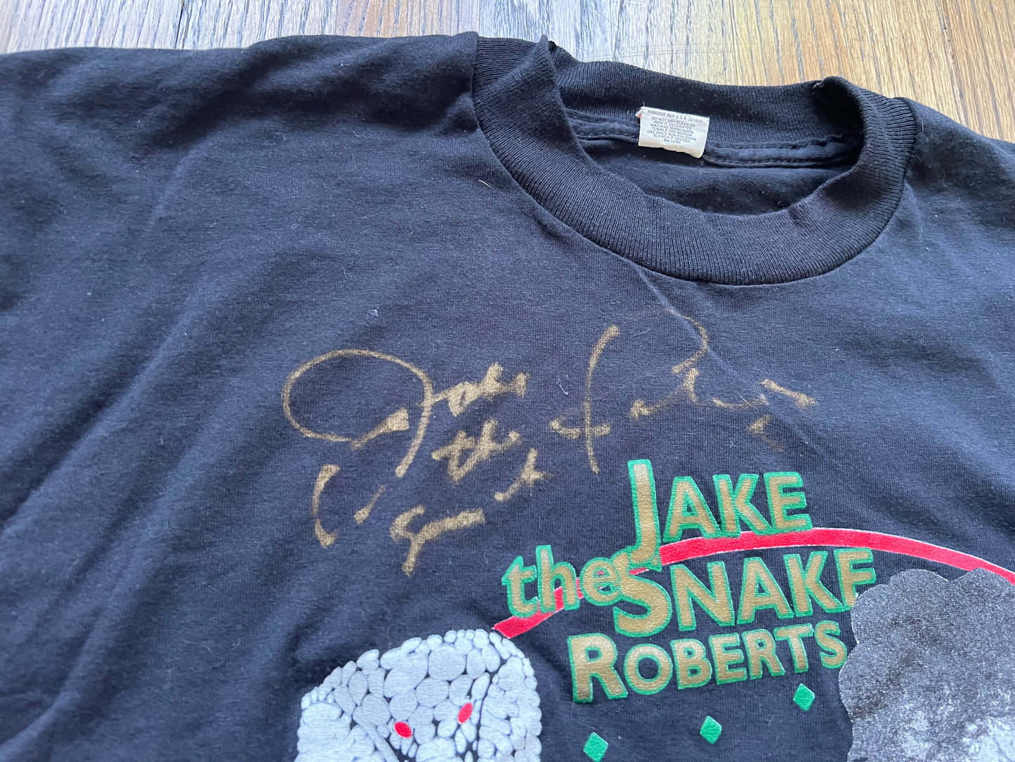 1993 Jake “The Snake” Roberts “Cruel But Fair” tour shirt signed by Jake and includes COA