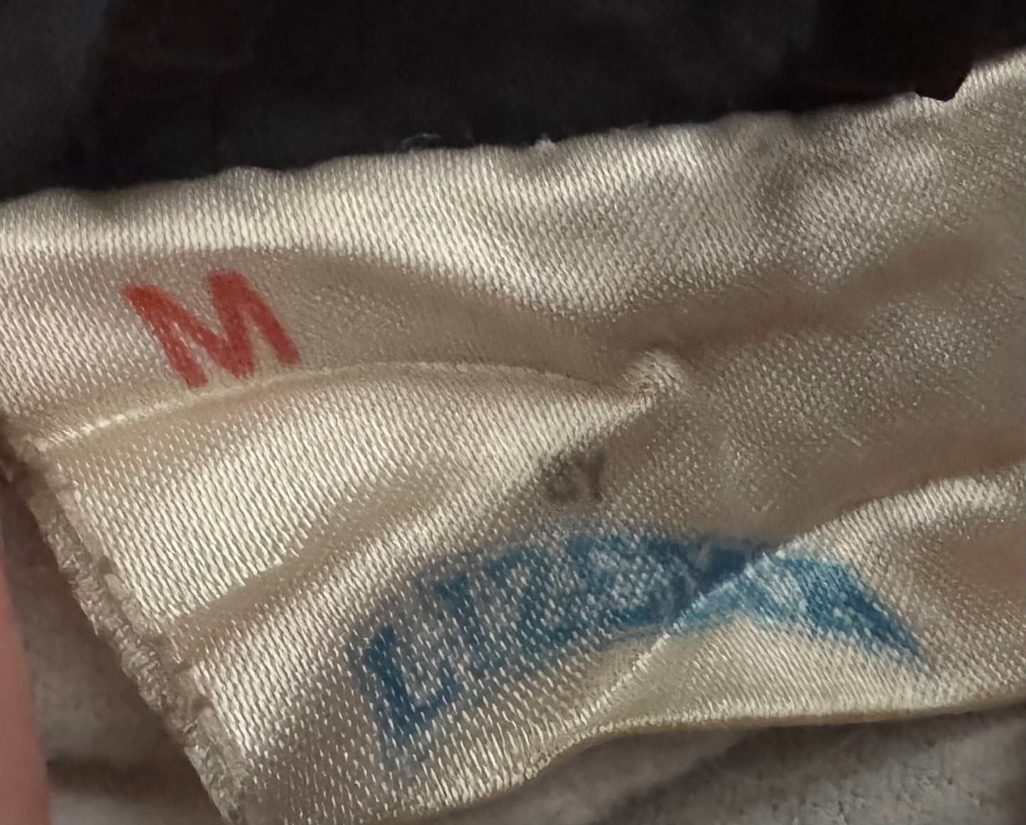 1995 WWF Undertaker windbreaker jacket with a zip up