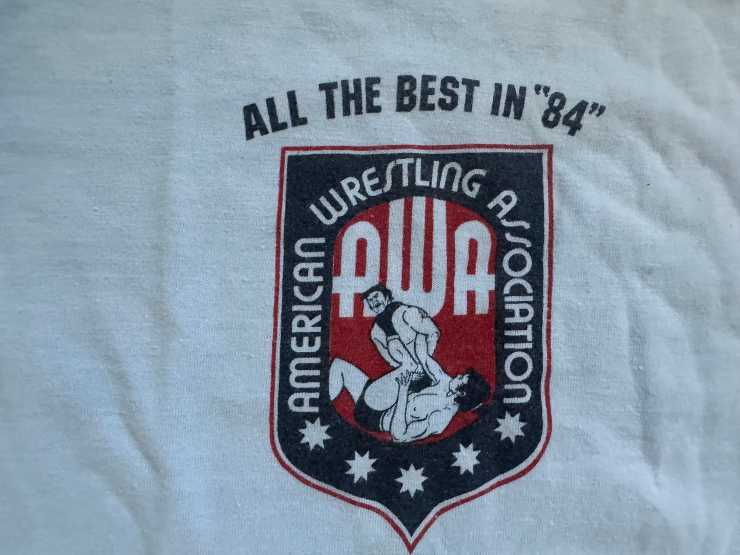 1984 AWA Roster shirt featuring Bobby “The Brain” Heenan, Rick Martel, Jesse Ventura, Nick Bockwinkle, Jim Brunzell (great high jumper!) and many more!