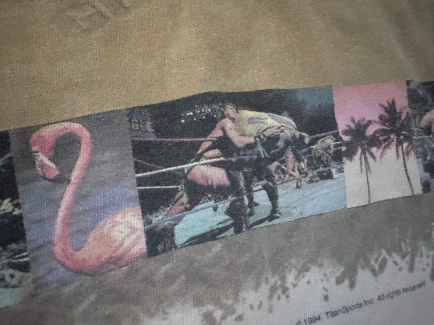 1995 WWF Royal Rumble shirt featuring a Flamingo, Bam Bam Bigelow, Crush’s 3rd gimmick in 3 years, Tatanka, Fatu, Sir Mo, Maybe the Smoking Gunns? Palm Trees, Lex Luger and Adam Bomb