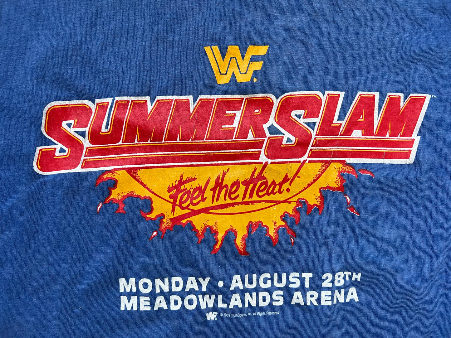 1989 WWF Summerslam two sided shirt featuring “The Human Wrecking Machine” Zeus, “Macho Man” Randy Savage, Hulk Hogan and Brutus “The Barber” Beefcake