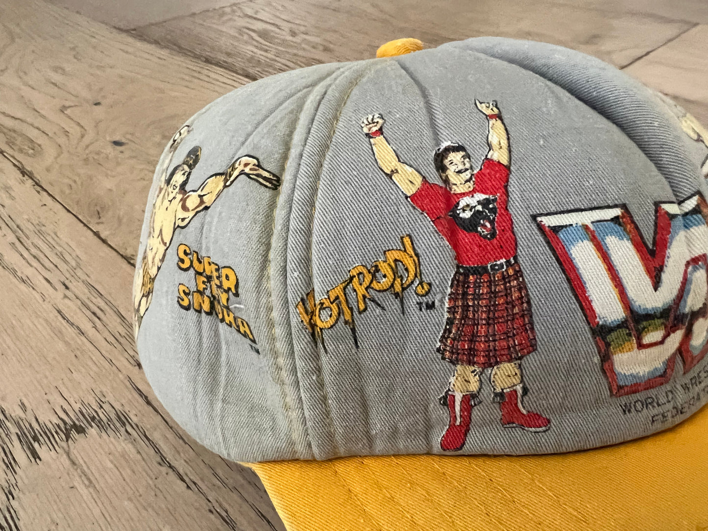 1985 WWF Kid’s Hat featuring World Wrestling Federation Heavyweight Champion Hulk Hogan, “Superfly” Jimmy Snuka, Andre the Giant and “Rowdy” Roddy Piper
