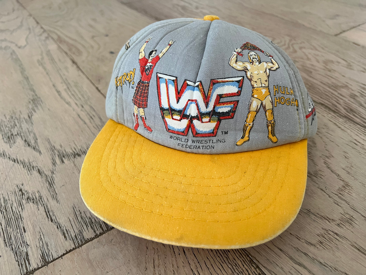 1985 WWF Kid’s Hat featuring World Wrestling Federation Heavyweight Champion Hulk Hogan, “Superfly” Jimmy Snuka, Andre the Giant and “Rowdy” Roddy Piper